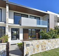 Villa Capri Waterside at Trinity Point - Suburb Australia